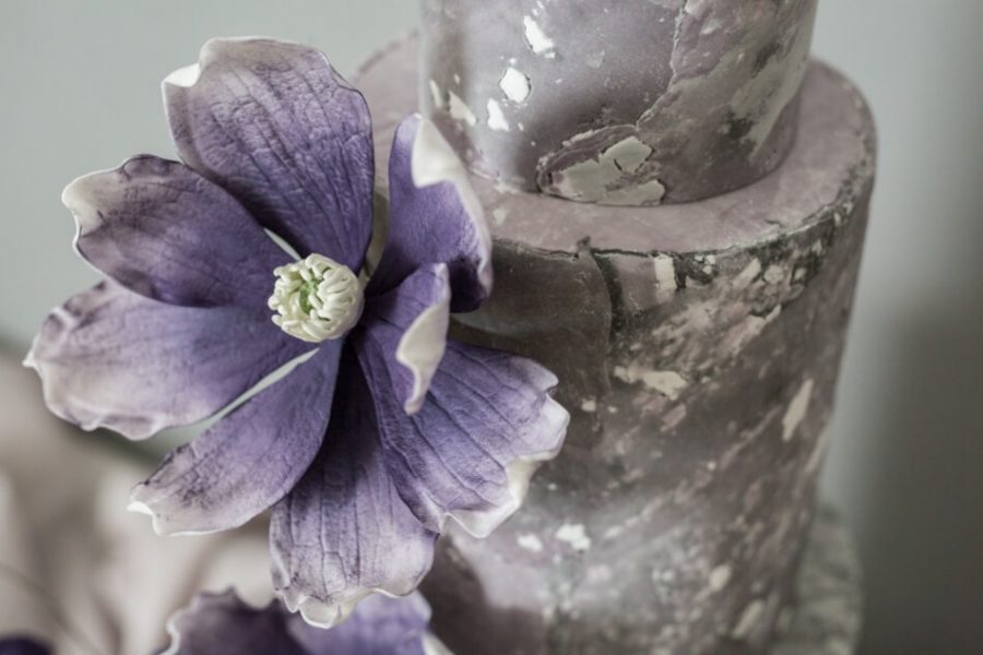 Textured wedding cake and magnolias
