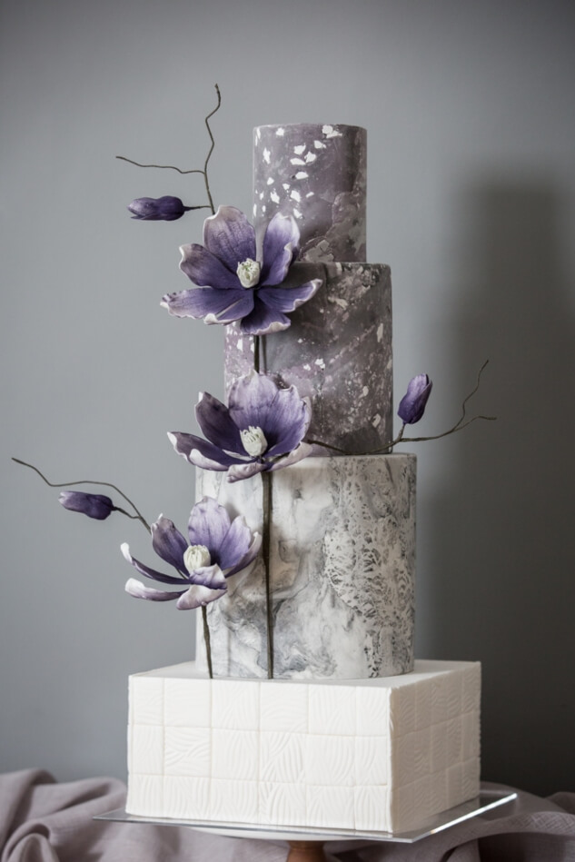 Modern concrete wedding cake and magnolias